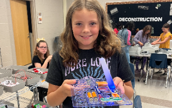 Student holding project made in the Innovation Lab