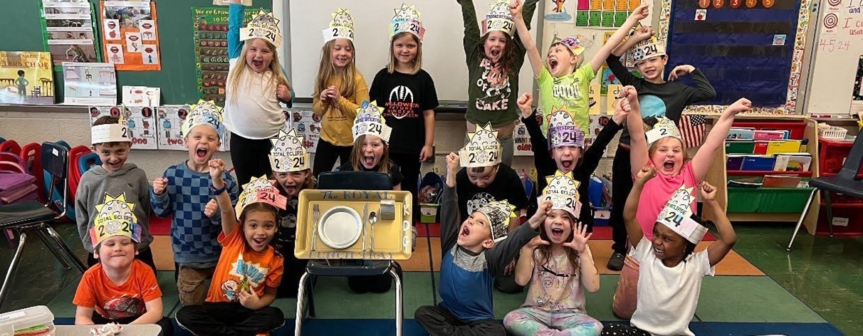 Students cheering in classroom