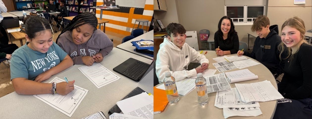 Two middle school students working on schoolwork together. Spanish teacher and students working together at a table.